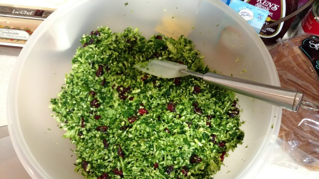Combine chopped brussel sprouts and chopped kale, add craisins and toasted pecans.