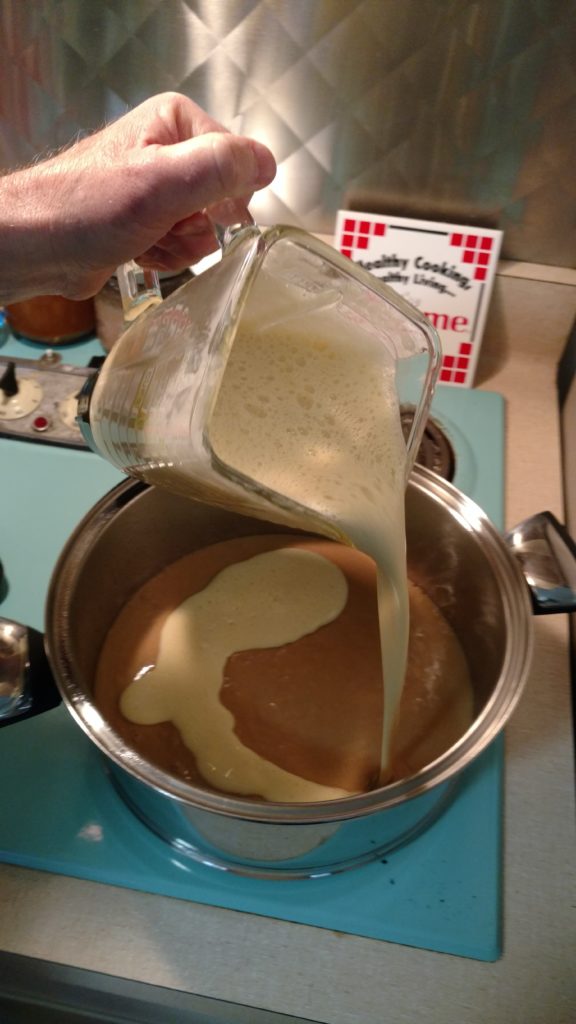 Spread flan evenly over cake mix